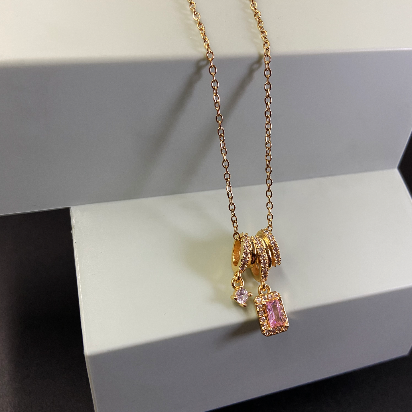 Chain with Multiple Rings & Pink Stone Pendant