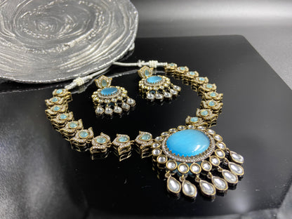 Fashionable Polki Set with Lotus Flower Strings and Blue Doublet Stones in Centre