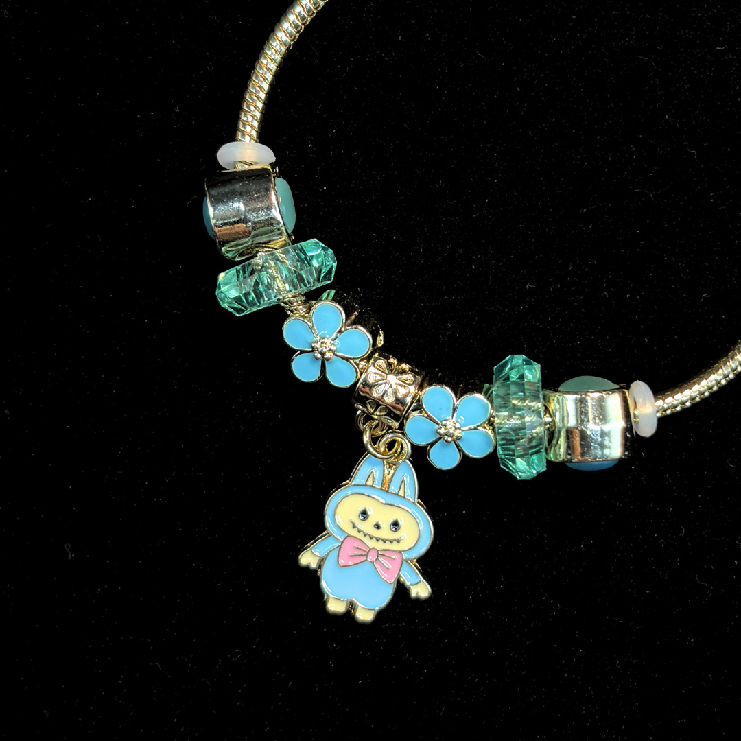 Charm Bracelet with teal enamel flower-shaped beads and a labubu charm on a black background